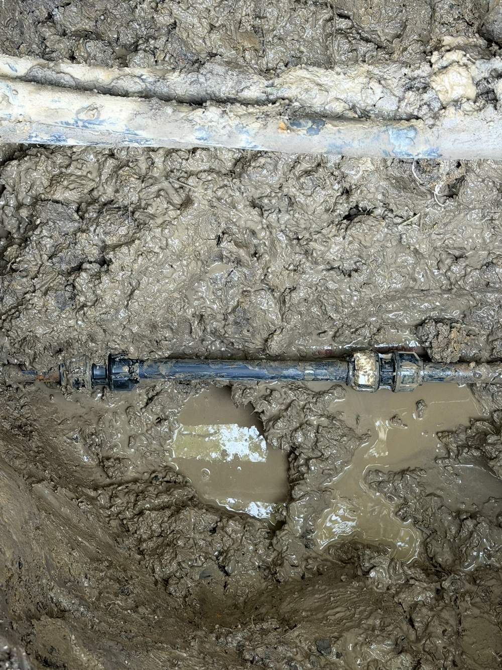 New section of 25mm blue-line poly water pipe and fittings installed during a burst pipe repair in Beaconsfield