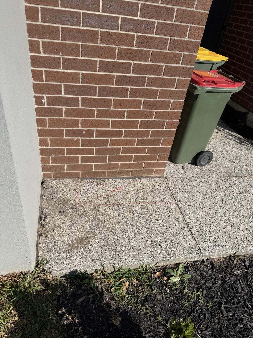 Concrete marked for access after locating a hidden recycled water leak at a Clyde property