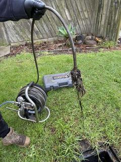 Tree root mass removed from a blocked stormwater drain during hydro jetting in Clyde