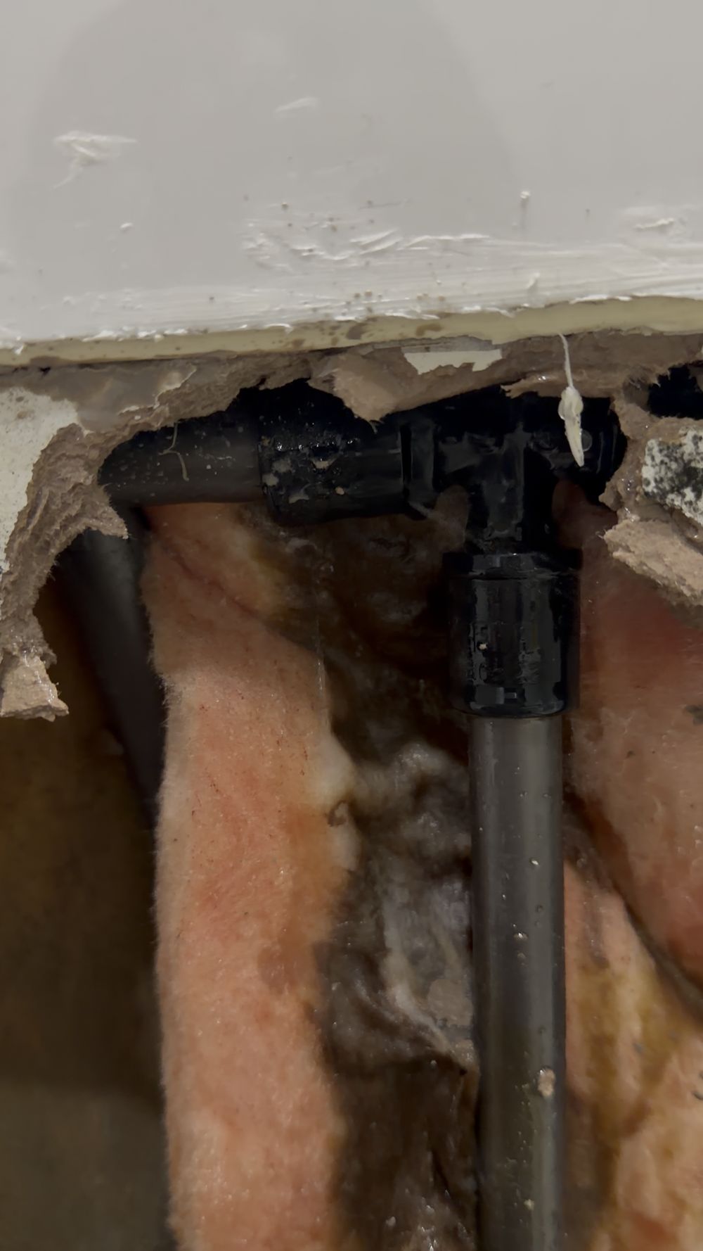 Concealed hot water pipe leak repair behind bathroom vanity in Berwick