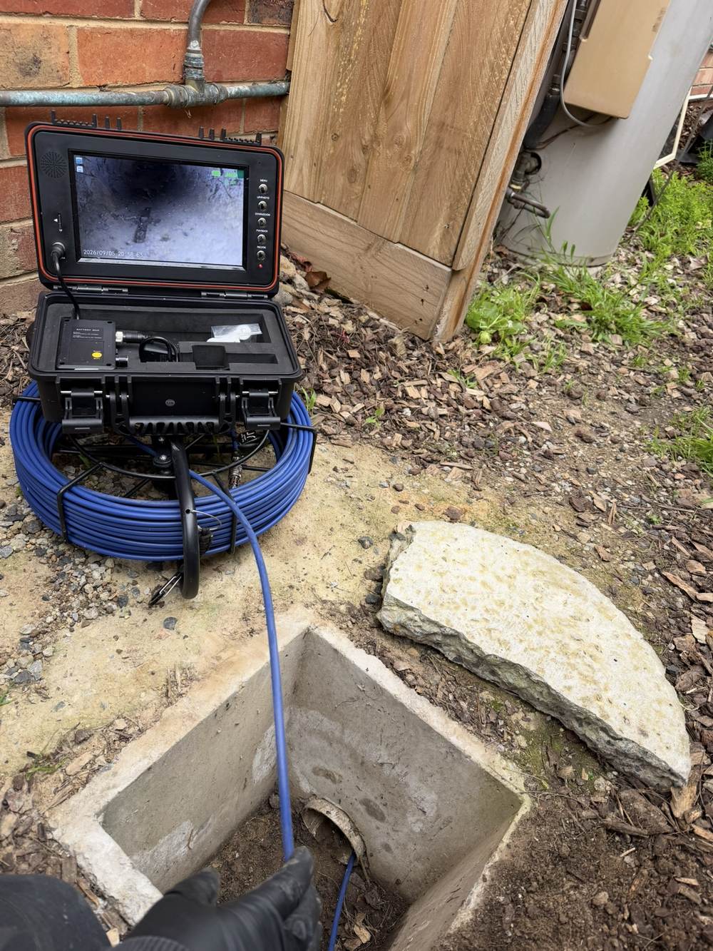 CCTV drain camera equipment set up beside an open stormwater pit during a drainage inspection in Cranbourne